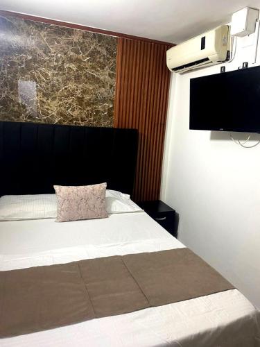 Una cama o camas en una habitación de Hotel Bahia Suite In