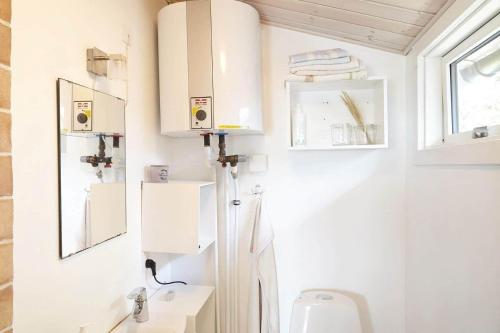 a bathroom with a toilet and a sink at 15524-Farevejle-Lynghoj-5 in Fårevejle
