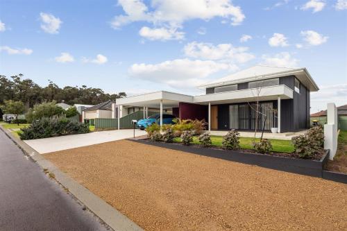 a house with a driveway in front of it at Sedgeway Place in Margaret River Town