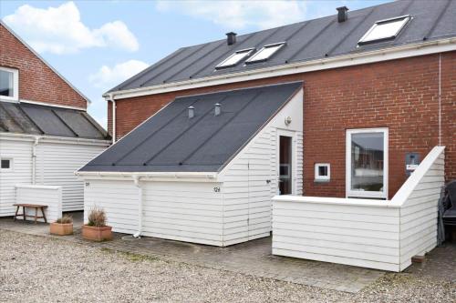 a large white building with a black roof at 0366-Romo-Vestergade-153-B-Ap-126 in Sønderby