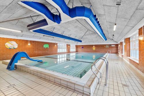 an indoor swimming pool with a large swimming poolvisor at 0366-Romo-Vestergade-153-B-Ap-126 in Sønderby
