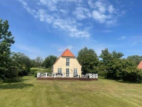 a large white house with a large yard at 10098-Rorvig-Fjordvaenget-17 in Rørvig