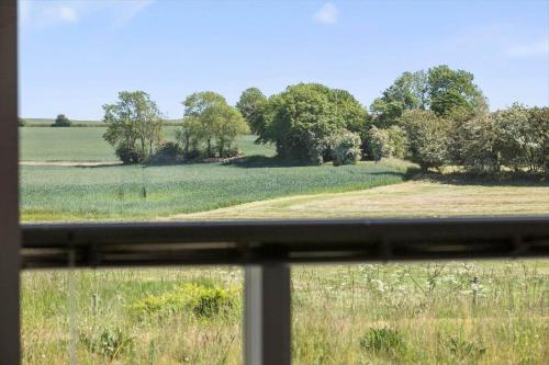 a view of a field from a window at 8014-Knebel-Rastestedet-16 in Knebel