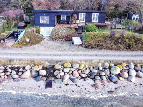 an aerial view of a house with a bunch of rocks at FJ3200-Frederikssund-Strandvej-58 in Frederikssund