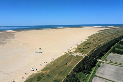 an aerial view of a beach with people on it at 0351-Romo-Regnspoven-8 in Mølby