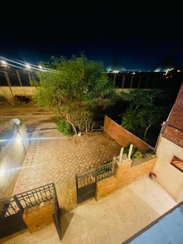 an overhead view of a patio at night at Farida Pyramids ŌTEL in Cairo