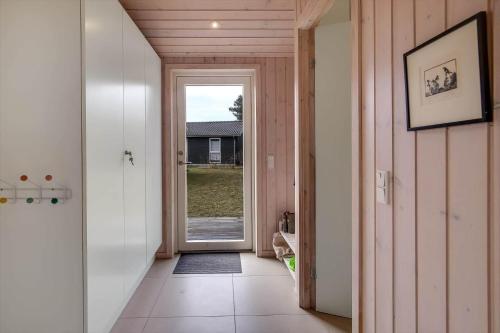 a hallway with a door leading into a house at 11185-Nykobing-Sj-Lynghaekken-8 in Nykøbing Sjælland