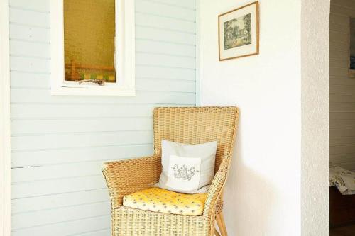 a wicker chair with a pillow sitting in it at 11817-Nykobing-Sj-Solystgardsvej-16 in Nyrup