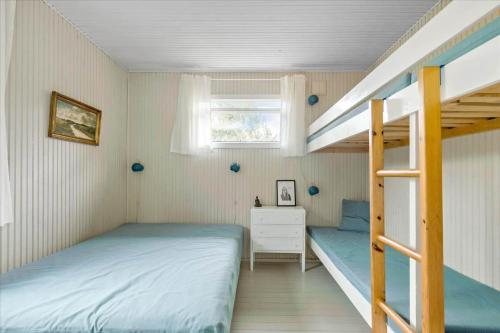 a bedroom with two beds and a bunk bed at 11176-Nykobing-Sj-Birkehaekken-13 in Nykøbing Sjælland