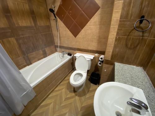 a bathroom with a toilet and a sink and a tub at ANANTAYA CHIANGMAI BOUTIQUE HOTEL in Chiang Mai