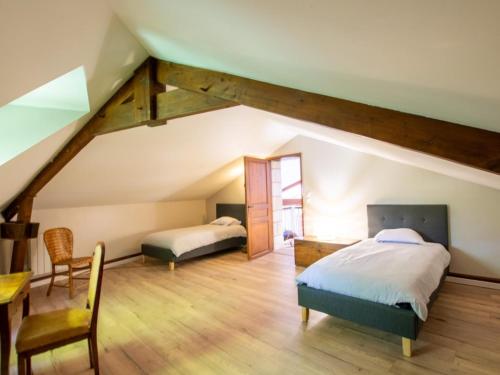 Ένα ή περισσότερα κρεβάτια σε δωμάτιο στο Charmant gîte en pierre avec piscine chauffée, proche Périgueux - FR-1-616-480