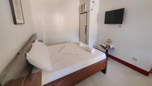 Кровать или кровати в номере Pring Pension House