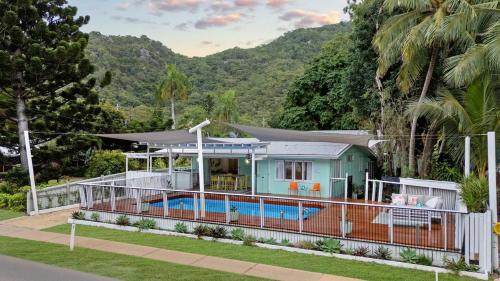 a house with a pool in front of it at Welcome to The Island House in Arcadia