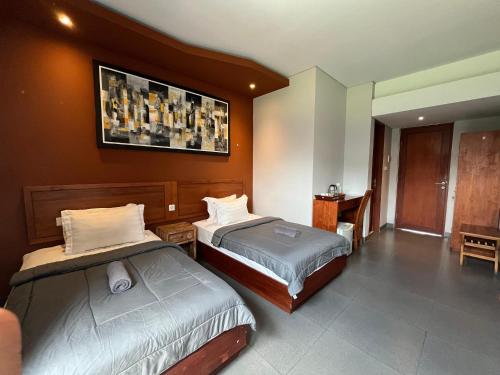 Katil atau katil-katil dalam bilik di ODA Guest House Umalas