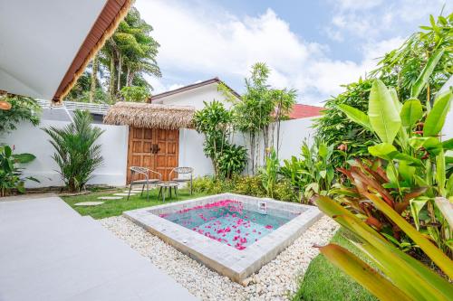 a small pool in the yard of a house at Baan Saint-Tropez Seaview Villas Kata Beach in Kata Beach