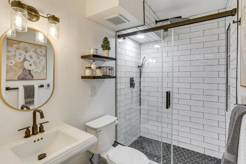 a bathroom with a toilet and a sink and a shower at Hike, Ski and Golf Fully Renovated Edwards Townhome in Edwards