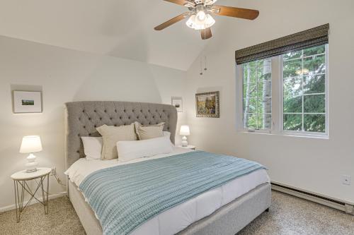 a bedroom with a bed with a ceiling fan and a window at Hike, Ski and Golf Fully Renovated Edwards Townhome in Edwards