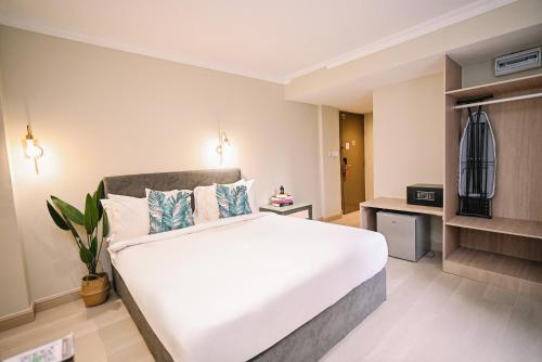 Postel nebo postele na pokoji v ubytování Kingston Hotel 6 - Changkat, Bukit Bintang