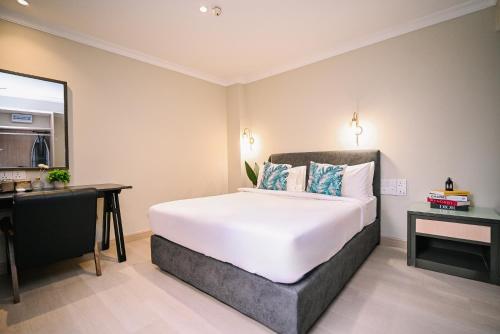 Postel nebo postele na pokoji v ubytování Kingston Hotel 6 - Changkat, Bukit Bintang