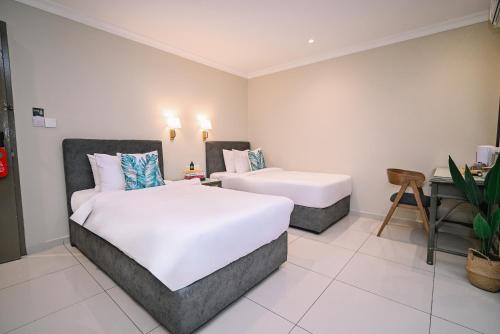 Postel nebo postele na pokoji v ubytování Kingston Hotel 6 - Changkat, Bukit Bintang