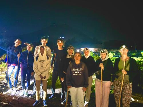 a group of people posing for a picture at Bali Cottages Lake View in Kintamani