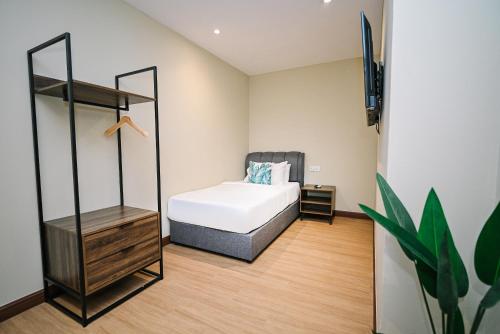 Postel nebo postele na pokoji v ubytování Kingston Hotel 6 - Changkat, Bukit Bintang