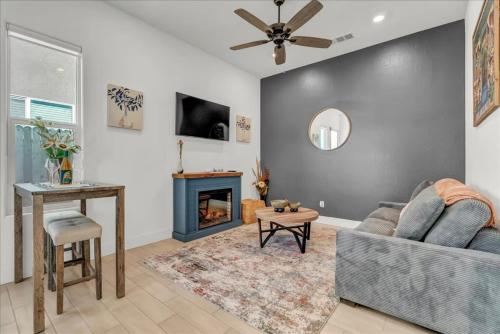 a living room with a couch and a fireplace at Peaceful Guest Casita with Private Entrance and No Cleaning Fee in Hanford
