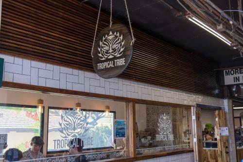 a restaurant with a sign that says tiger in the window at Waikiki Shore by OUTRIGGER in Honolulu