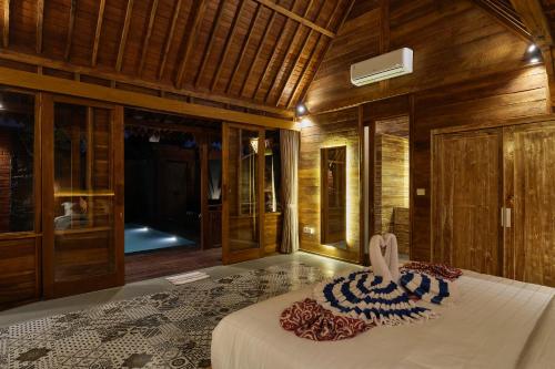 Ένα ή περισσότερα κρεβάτια σε δωμάτιο στο Bali Holiday Ubud