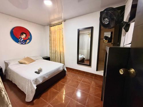 Una cama o camas en una habitación de Hotel Villeta Tradicional