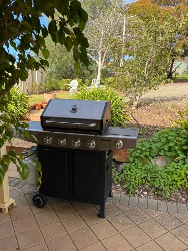 a barbecue grill sitting on top of a patio at Barossa Garden Homestay in Williamstown