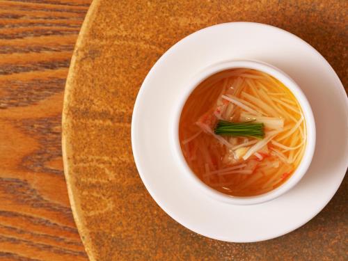 a bowl of soup on a plate on a table at Hakone Hisui in Hakone