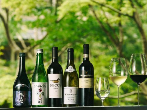 a group of wine bottles and glasses on a table at Hakone Hisui in Hakone