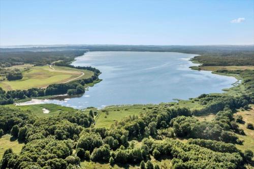 an aerial view of a river with trees at 84127-Ebeltoft-Magevej-19 in Ebeltoft