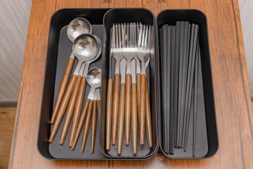 a tray of utensils sitting on top of a table at Wajiro Good Place House in Fukuoka