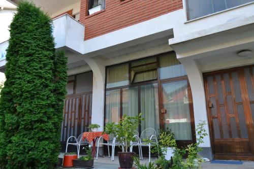 a house with a table and chairs and a tree at Apartment in Prilep in Prilep