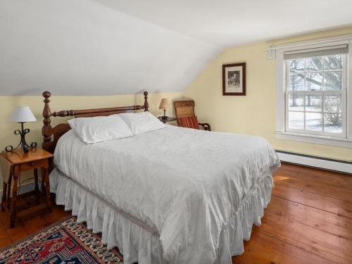 Ένα ή περισσότερα κρεβάτια σε δωμάτιο στο Whitford House Cottage