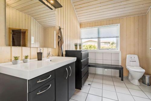 a bathroom with a sink and a toilet at 8424-Knebel-Rastestedet-46 in Knebel