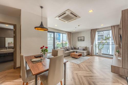 a living room with a table and a couch at Mansion 51 Hotel & Apartment in Phnom Penh