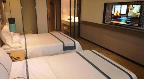 Ένα ή περισσότερα κρεβάτια σε δωμάτιο στο City Comfort Inn Mianyang Southwest University Of Science And Technology