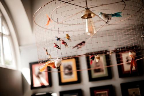 a bunch of shoes hanging from a ceiling at The Queen's Head in Kingston upon Thames