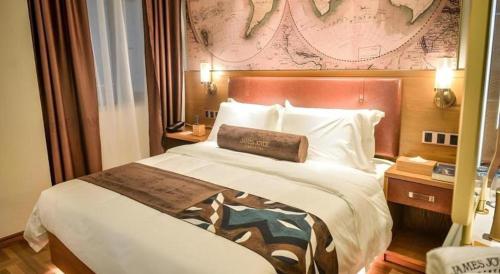 a bedroom with a large bed in a hotel room at James Joyce Coffetel Luoyang Longmen High-speed Railway Station Baolong Plaza in Luoyang