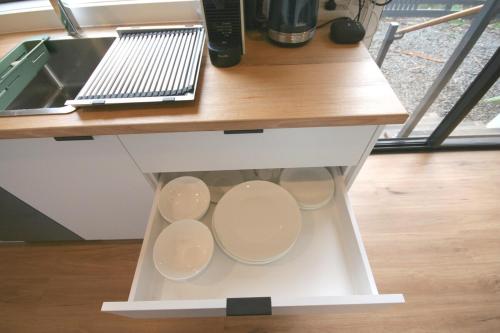 a drawer under a kitchen counter with a sink at Kookaburra's Perch in Millgrove