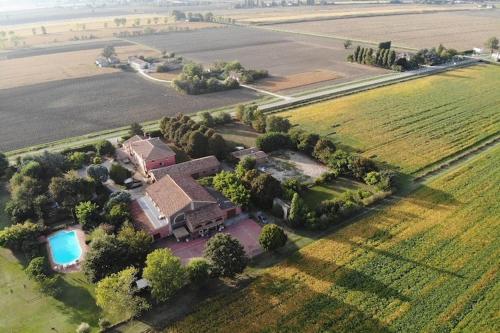 an aerial view of a house in a field at Pet-Friendly Nature Escape in Pontecchio Polesine