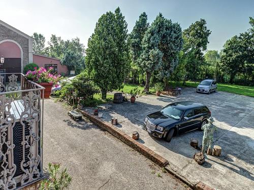 a car parked in the driveway of a house at Pet-Friendly Nature Escape in Pontecchio Polesine