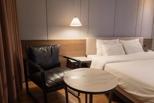 Katil atau katil-katil dalam bilik di Nampo Button Hotel