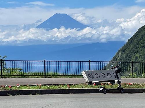 a shopping cart sitting on the side of a road at TAKUMI-AN Private Ancient House and Garden in Numazu