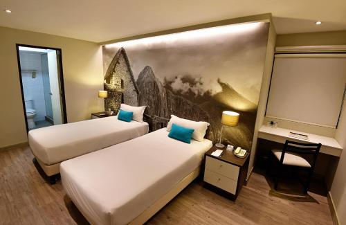 Cama o camas de una habitación en Mariel Hotel Boutique