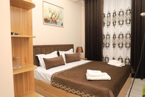 En eller flere senge i et værelse på Boutique Hotel Mubina with Pool and Sauna