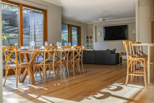 a dining room with a table and chairs at The Willows Coastal Retreat in Old Ocean Grove in Ocean Grove